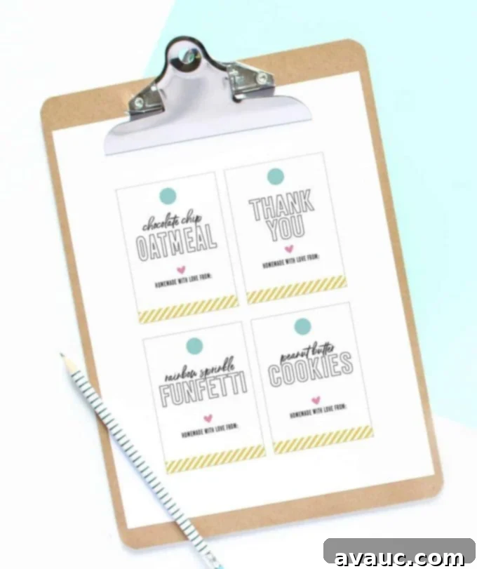 Clipboard holding several colorful printable cookie gift tags ready for cutting and attaching