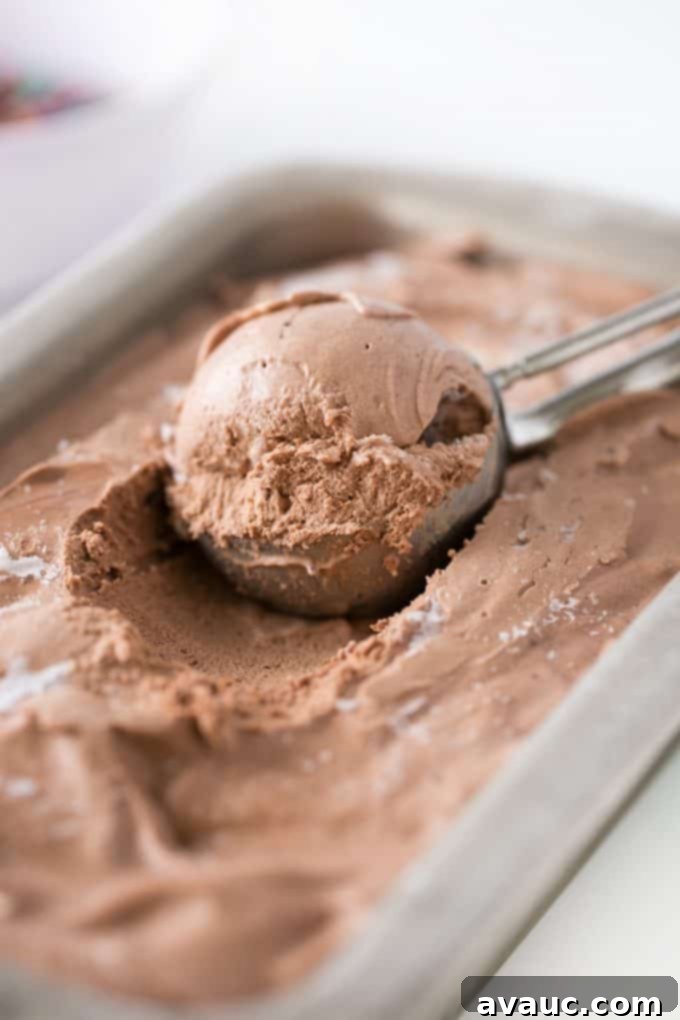 Ice cream scoop scooping chocolate no-churn ice cream, showing its creamy texture