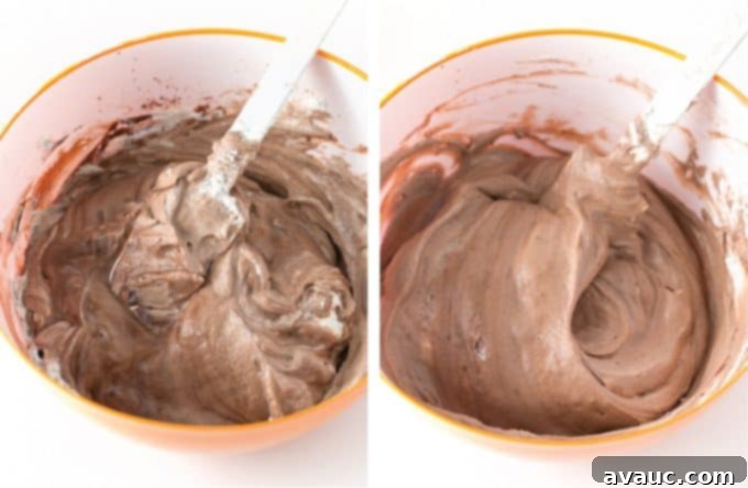 Folding whipped cream into the chocolate mixture with a spatula for chocolate no-churn ice cream, showing the technique for maintaining airiness