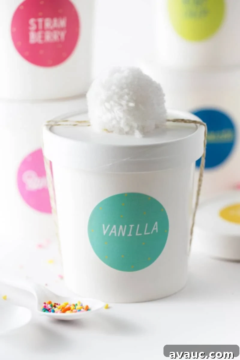 Layered cake and frosting in a paper ice cream cup with a printable label