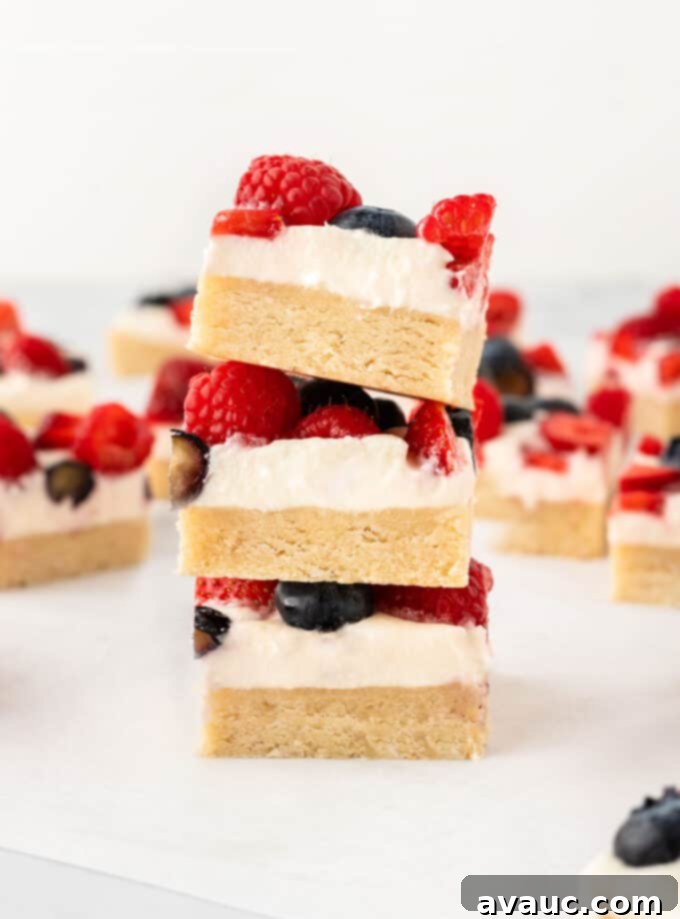 Sugar Cookie Fruit Pizza Bars 3 Close-up of freshly washed and dried blueberries, raspberries, and sliced strawberries, ready for topping the fruit pizza.