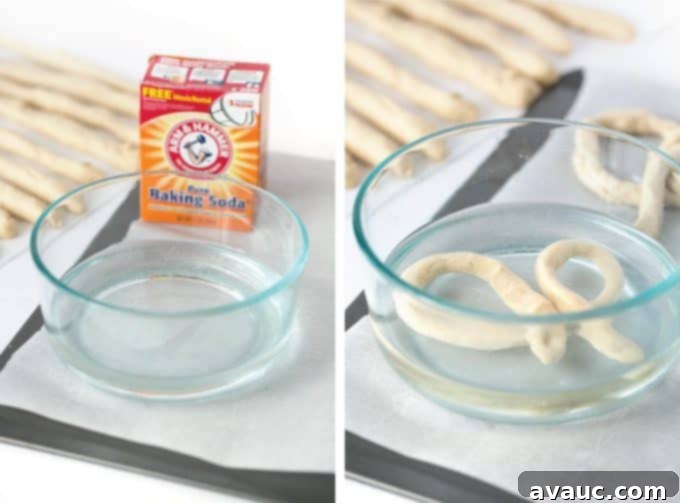Dipping pretzel dough in baking soda and water mixture before shaping