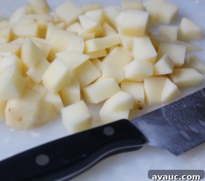 Hearty Potato and Egg Scramble 3 Diced Russet potatoes ready for cooking in a Mexican potato and egg scramble recipe.