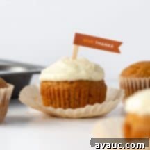 Simple Spiced Pumpkin Cupcakes 11 Close-up of a perfectly baked and frosted pumpkin cupcake.