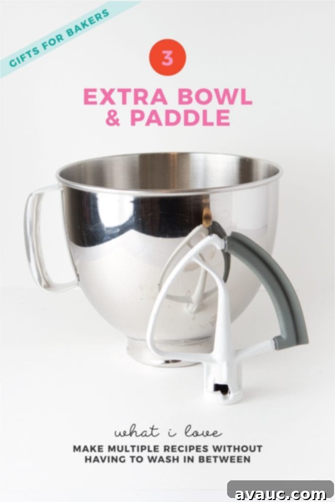 Two KitchenAid mixer bowls and a paddle attachment, highlighting the benefit of extras