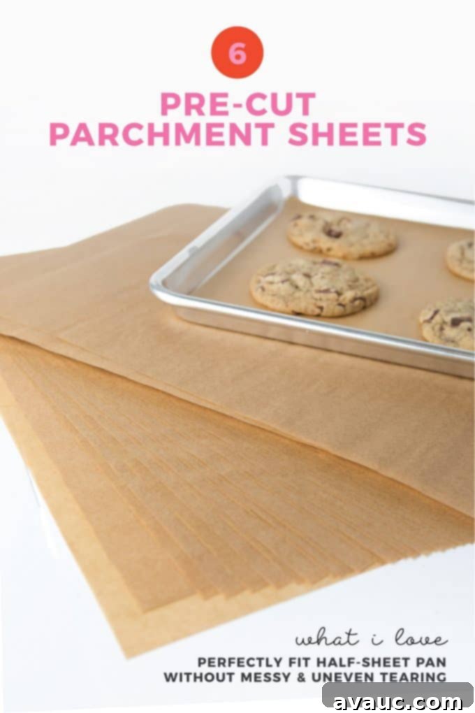 Stack of pre-cut parchment paper sheets on a baking tray