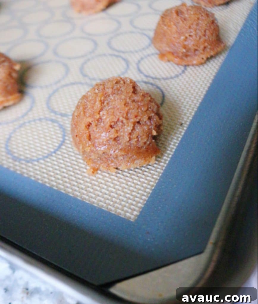 Dough for almond butter blossoms on cookie sheet