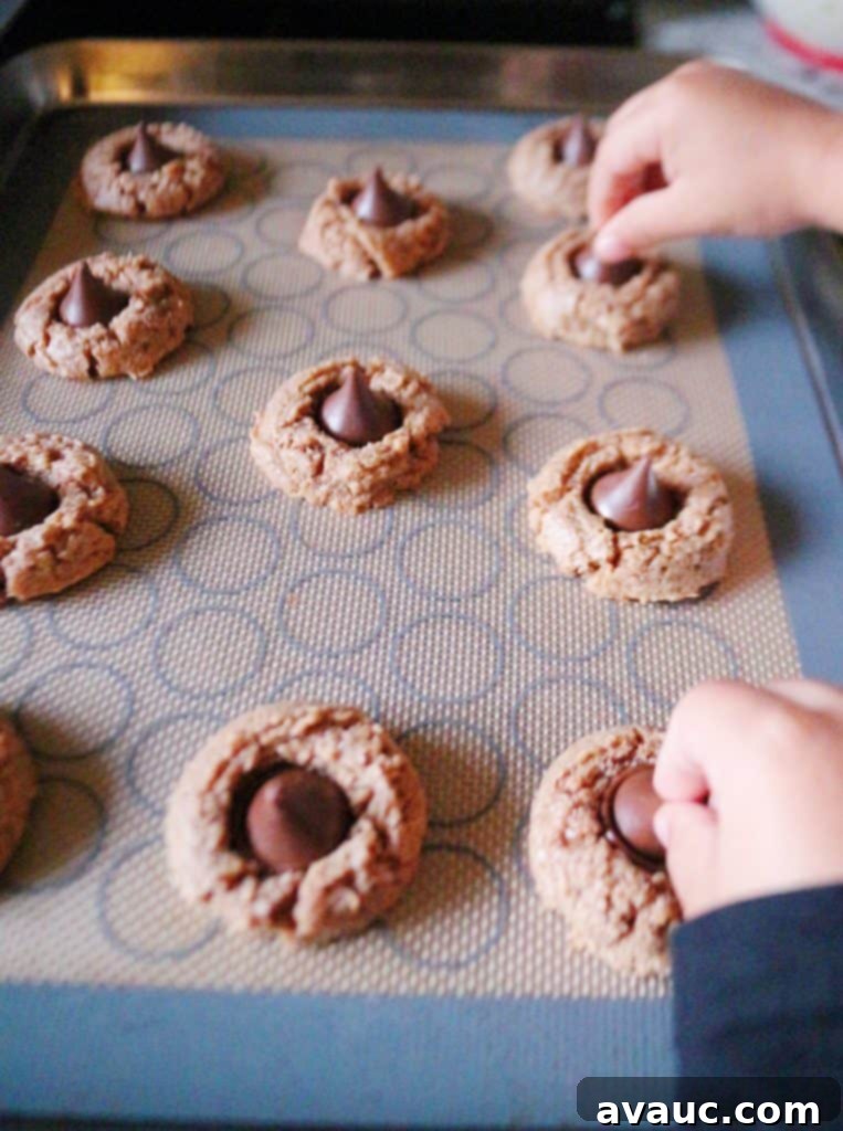 Kids making almond butter cookies #almondbuttercookies #almondbutterblossoms
