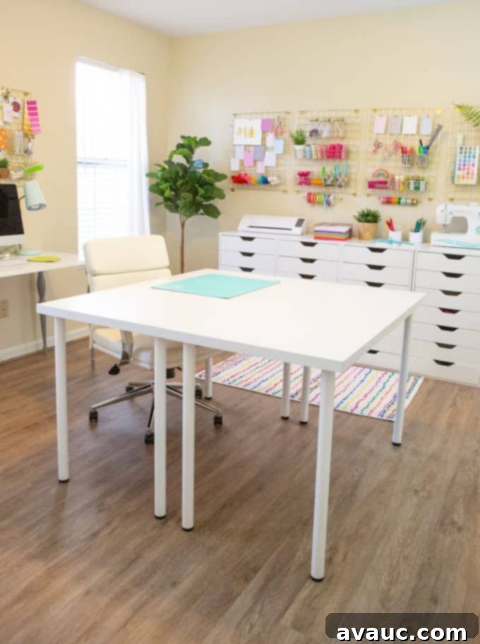Two white desks pushed together forming a large craft table.