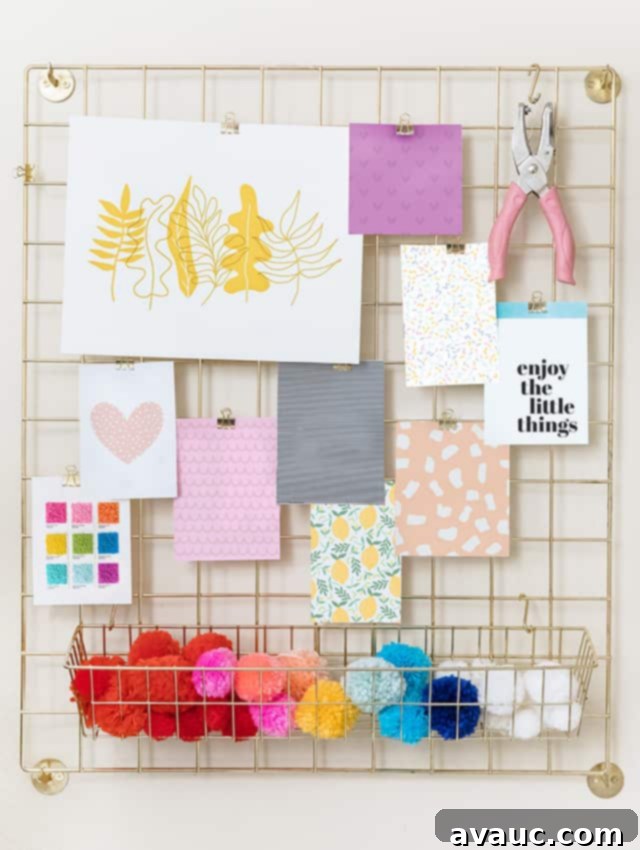 Colorful art prints and craft supplies arranged as decor on a desk.