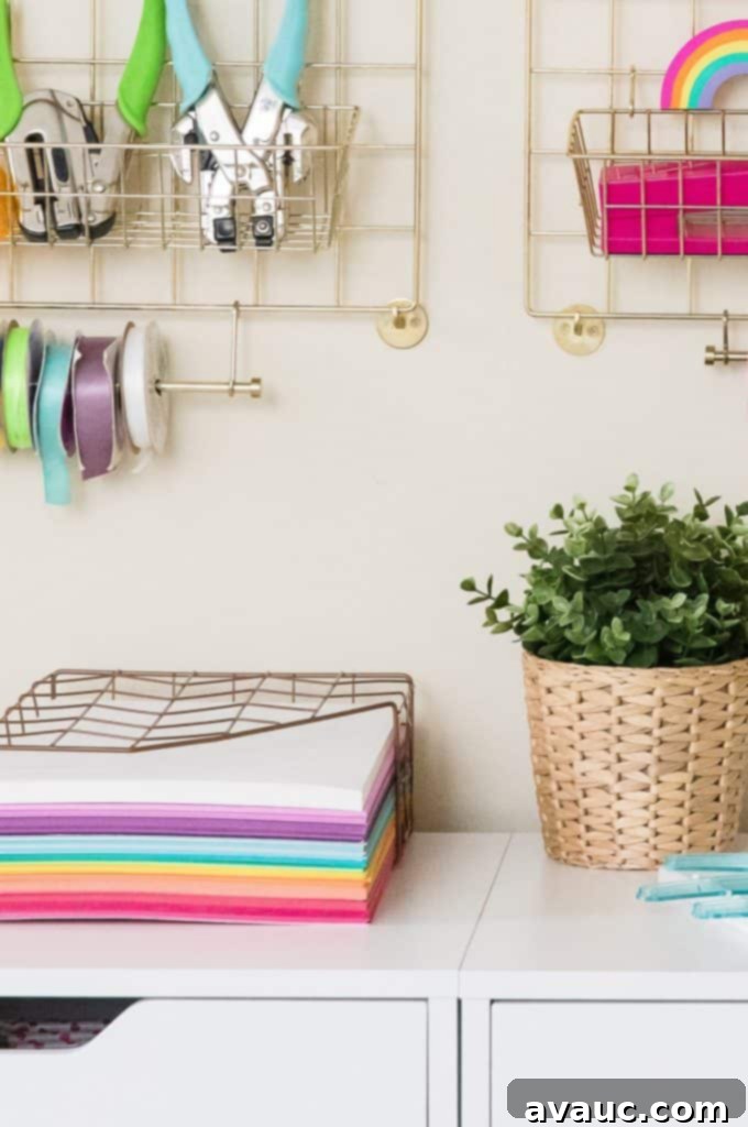 Wire wall organization system for a craft room, holding jars, bins, and ribbons.