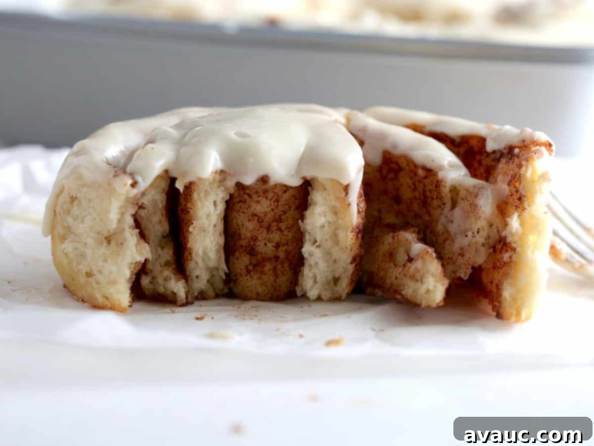 Baked cinnamon rolls cooling on a rack