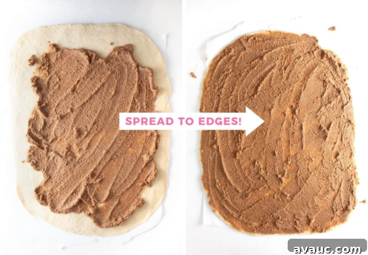Spreading cinnamon roll filling evenly on a sheet of dough, covering all edges
