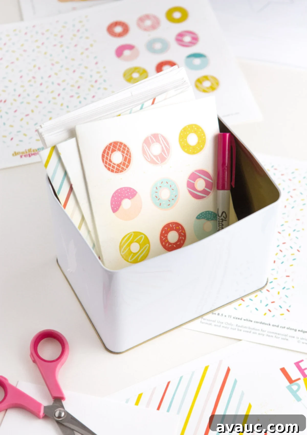 Donut Birthday Delight 4 Free donut printable birthday cards neatly stored in a tin box, showcasing a smart greeting card storage solution