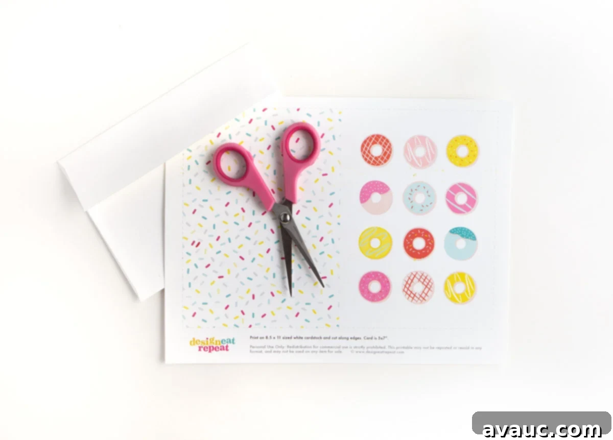 Donut Birthday Delight 5 Printed sheet of a donut printable birthday card next to a pair of scissors, ready for cutting