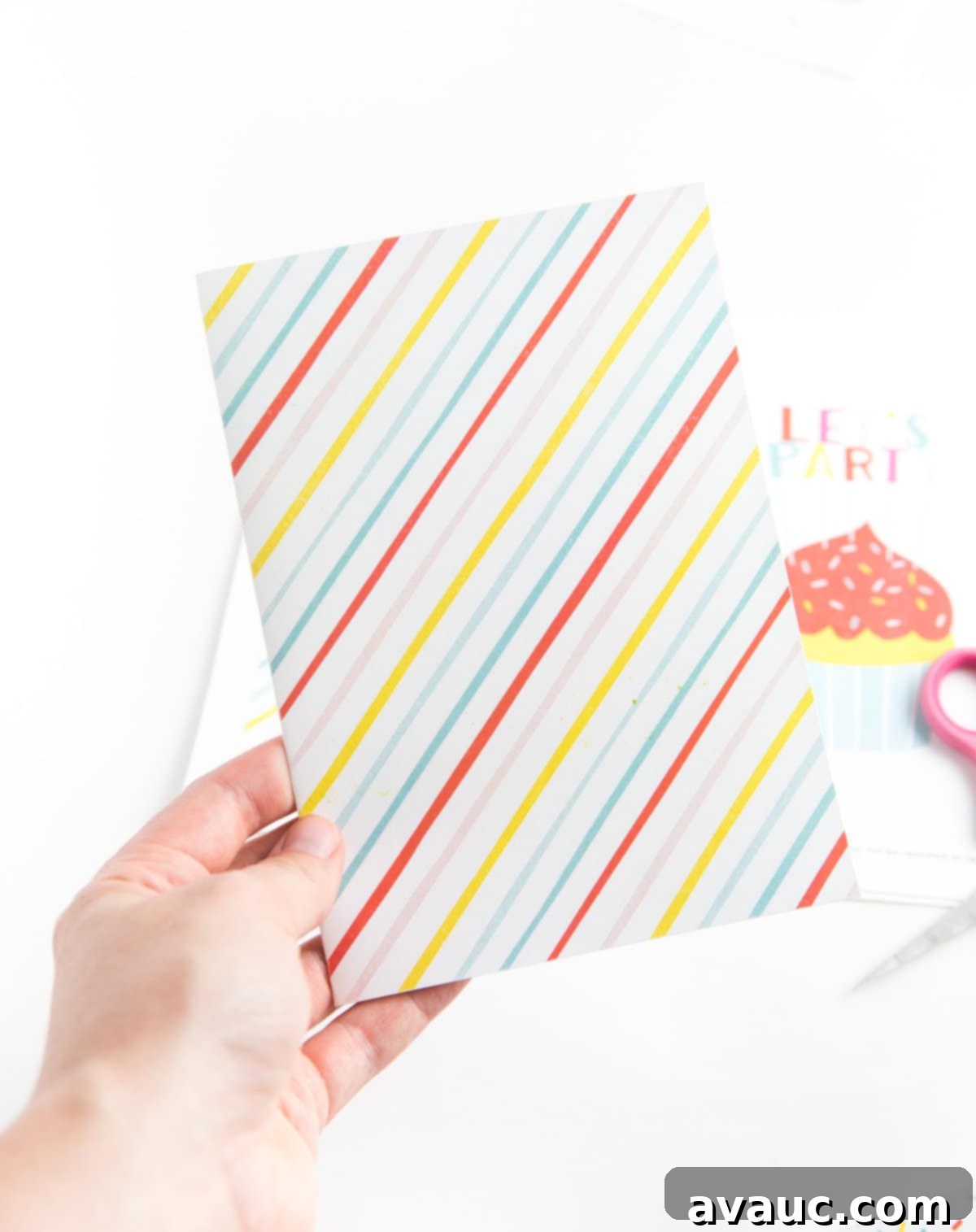 Sweetest Printable Birthday Treat 5 A person cutting and folding the printed cupcake birthday card along the edges