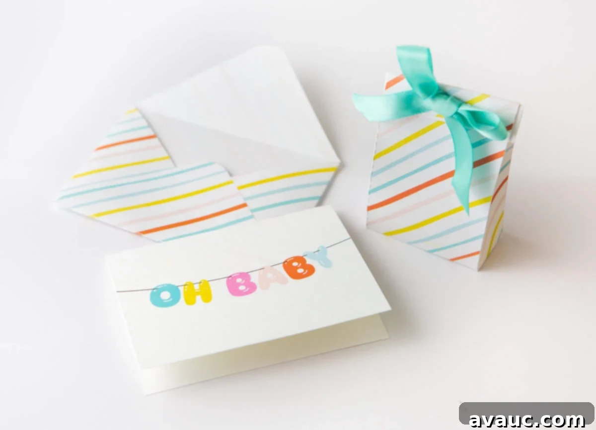 Close-up of a free printable baby card displaying 'Oh Baby' with colorful balloon letters, next to a matching envelope.