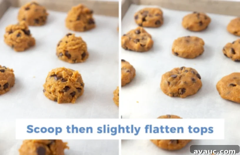 Cookie dough scoops of Chewy and Soft Gluten Free Peanut Butter Chocolate Chip Cookies, flattened into discs