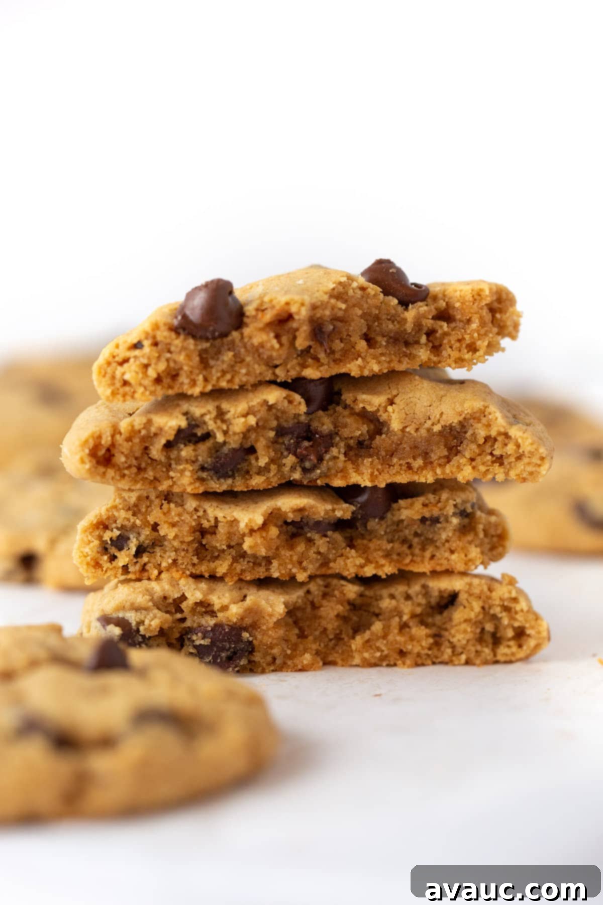 Stack of Chewy and Soft Gluten Free Peanut Butter Chocolate Chip Cookies, golden brown and perfectly baked