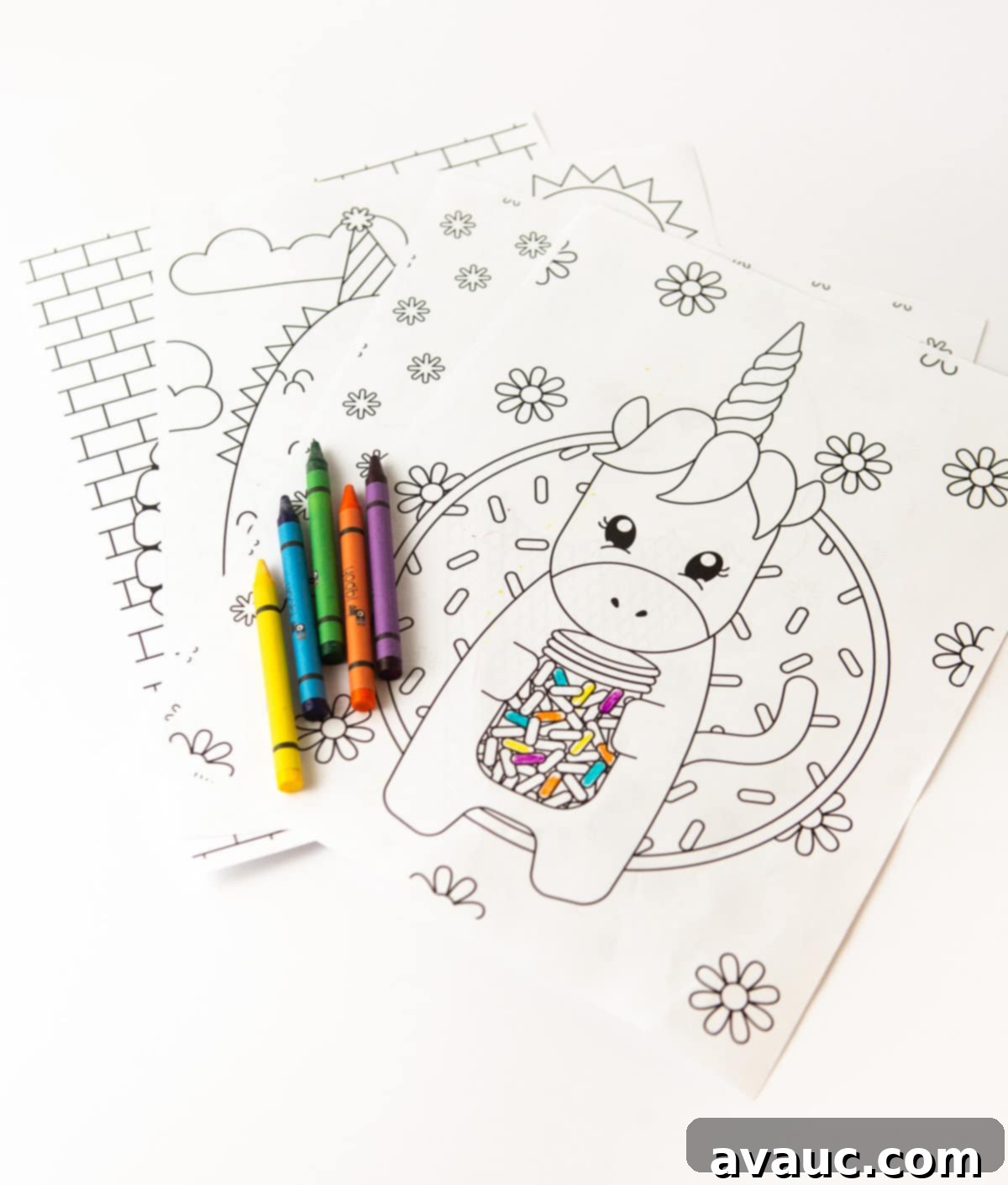 Adorable printable unicorn coloring page holding a jar of colorful sprinkles, ready for kids to color