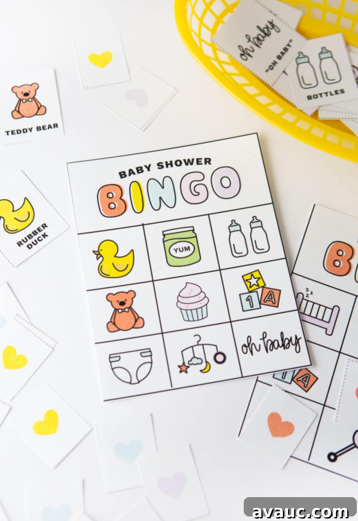 Baby shower bingo cards with pictures and icons; rubber duck, teddy bear, bottles, cupcake, diaper, blocks, baby food