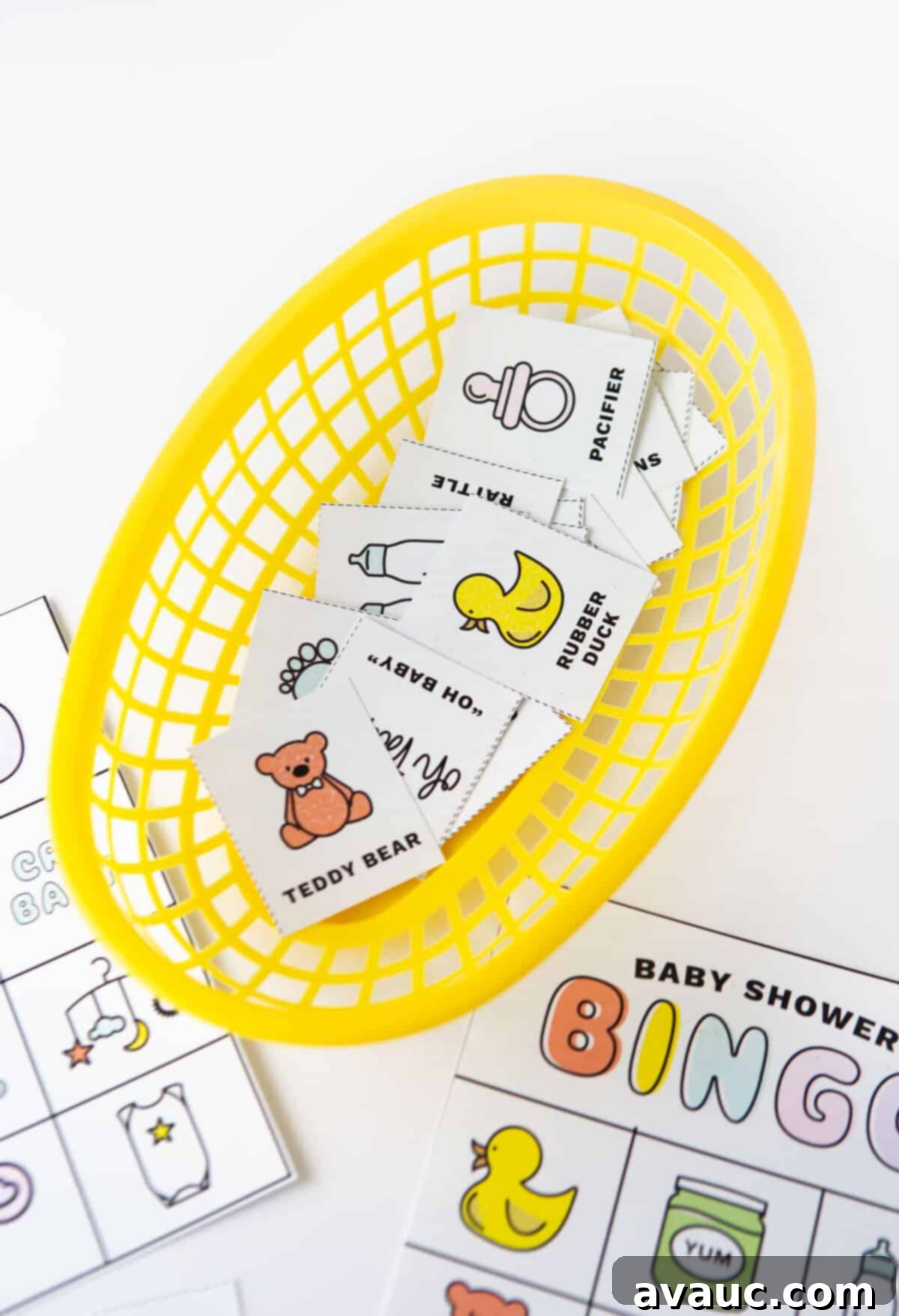 Basket of baby shower bingo calling cards