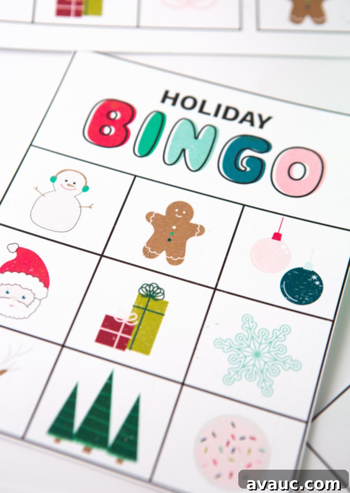 A close-up of a stack of neatly cut Christmas bingo cards, ready for playing.