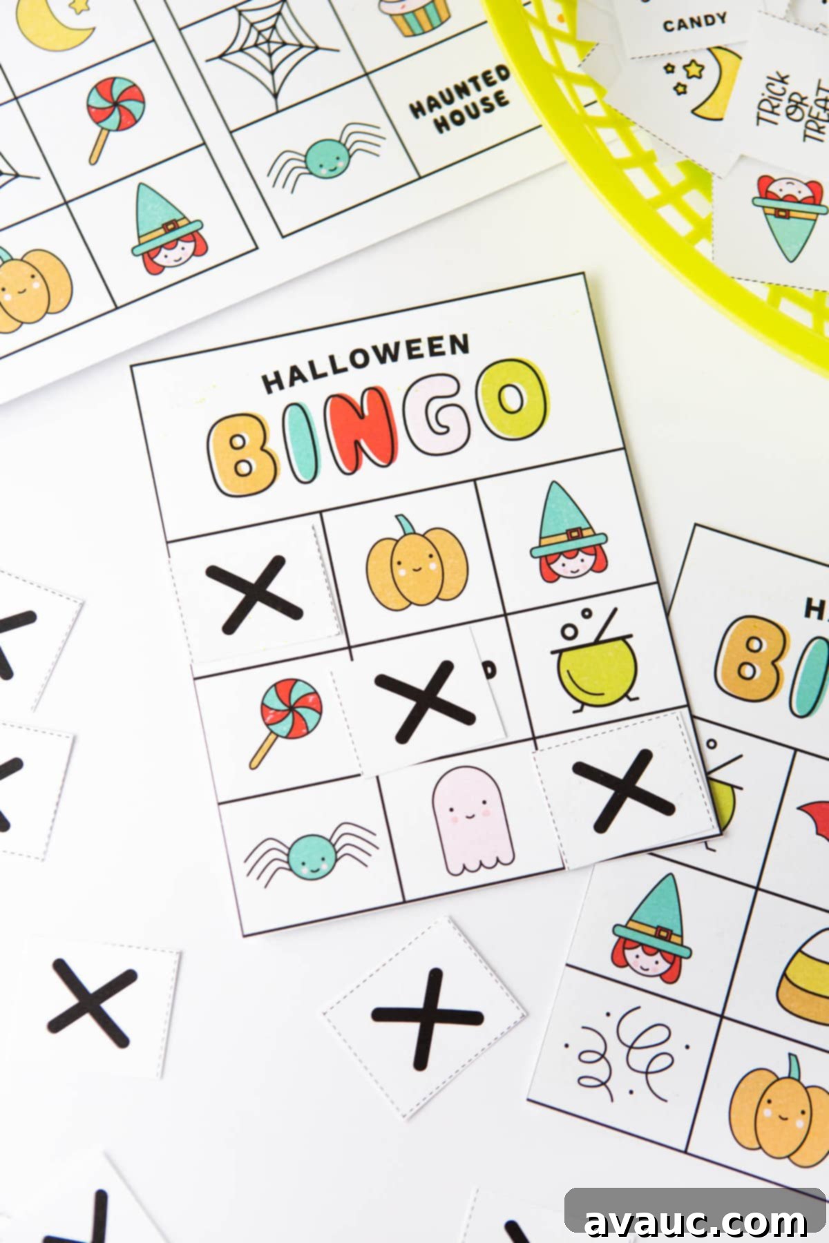 Spooktacular Halloween Bingo Fun 2 Colorful free printable Halloween bingo cards with icons and pictures: pumpkin, witch, lollipop, cauldron, spider, ghost