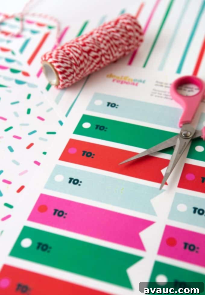 Printed sheet of green, red, pink, and blue printable Christmas gift tags "TO"