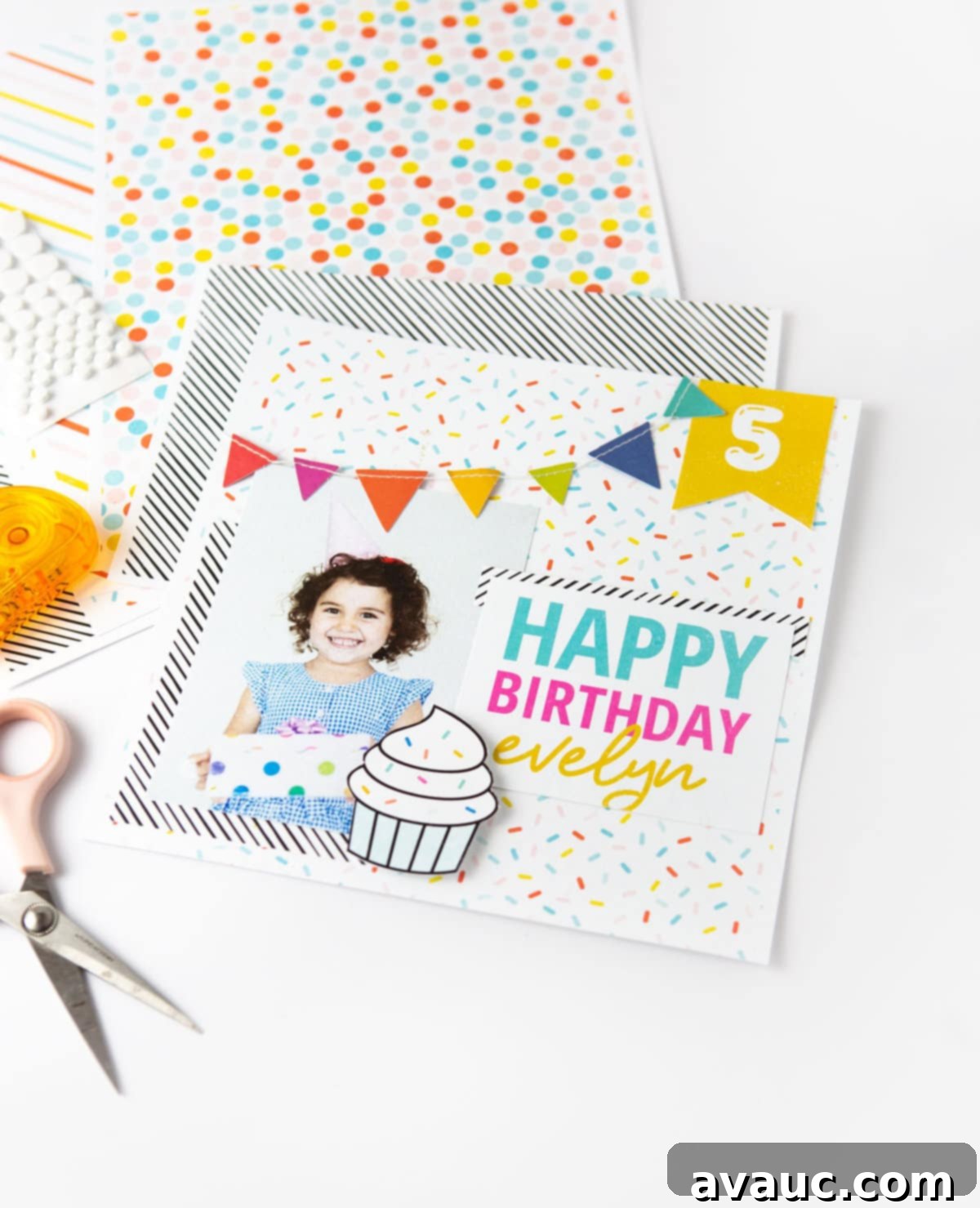 Colorful rainbow scrapbook page design with Happy Birthday text, cupcake, and banner