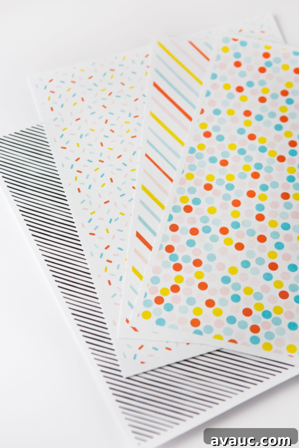 Rainbow printable scrapbook paper in sprinkle pattern, stripe, polka dot, and black and white stripe
