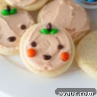 Spooktacularly Simple Pumpkin Cookies 8 Easy Halloween Pumpkin Cookies decorated with mini M&M's and frosting