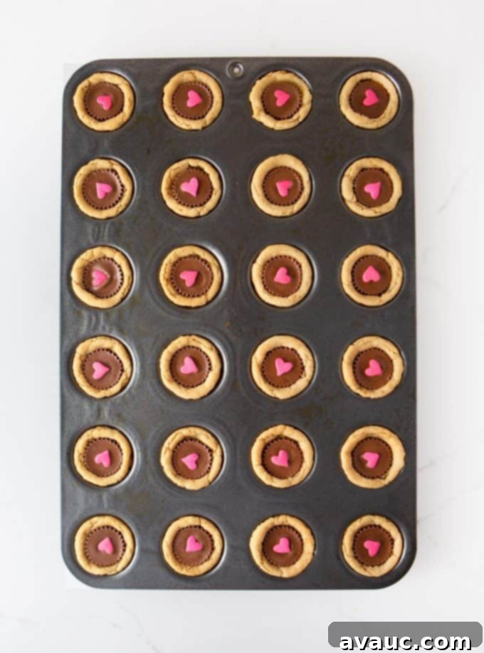 Mini muffin tin pan of Reeses Peanut Butter Valentines Cookie Cups