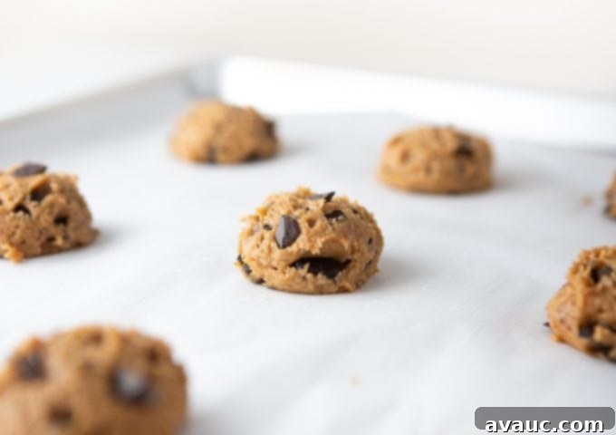 Peanut Butter Chocolate Chip Dream 9 Raw dough scoops of peanut butter chocolate chip cookies on baking tray