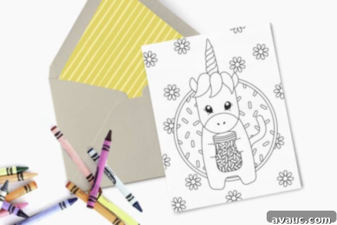 Magical Unicorn Birthday Printable 5 Printed 5x7 birthday card with unicorn design, accompanied by a kraft paper envelope and a set of crayons, highlighting a personalized touch.