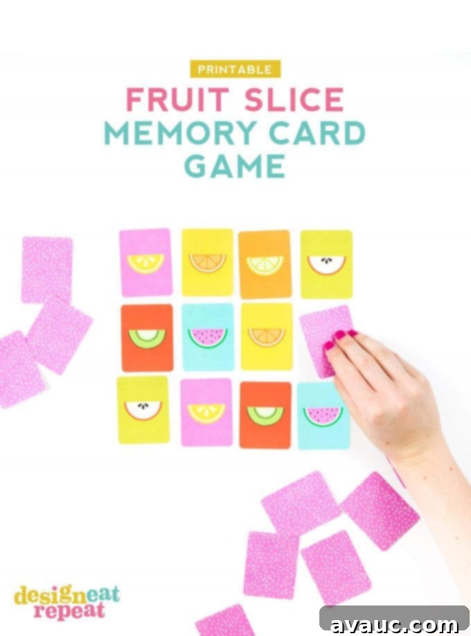 A child's hand carefully flipping over a colorful fruit slice memory game card, revealing a matching pair, perfect for developing memory skills.