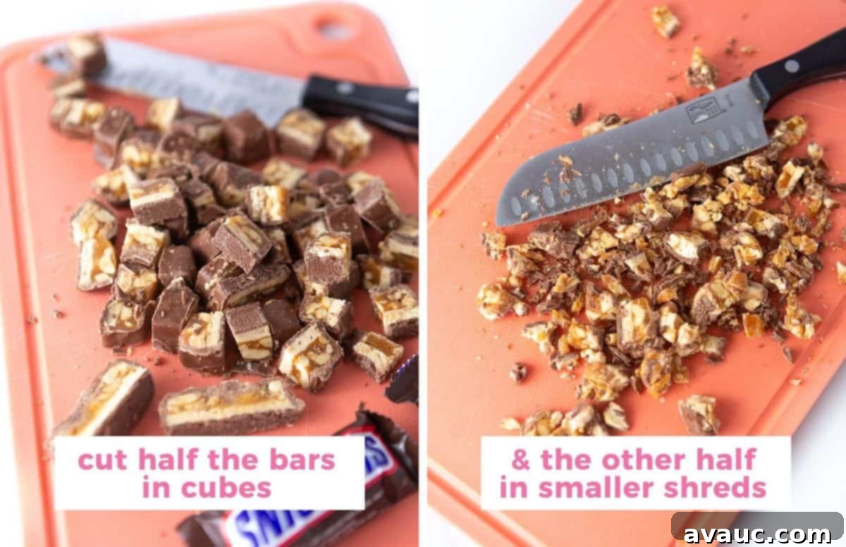 Cutting board chopping snickers candy bars with text overlay stating to cut half the bars in cubes, while cutting the other half into smaller shreds