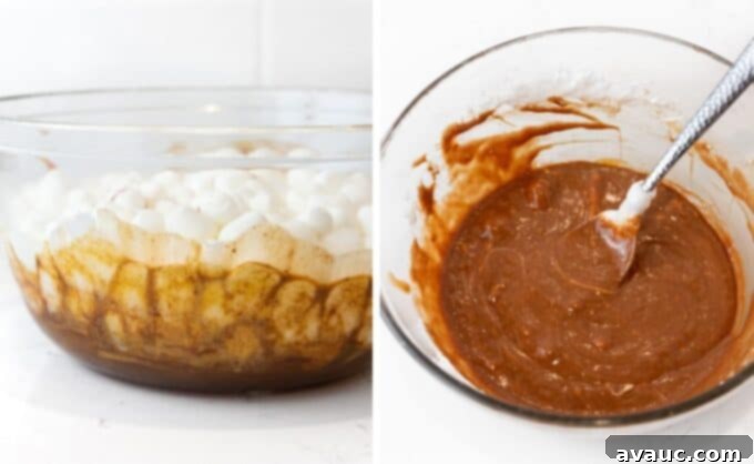 Melted chocolate, peanut butter, and butterscotch mixture with a layer of mini marshmallows on top, before stirring.