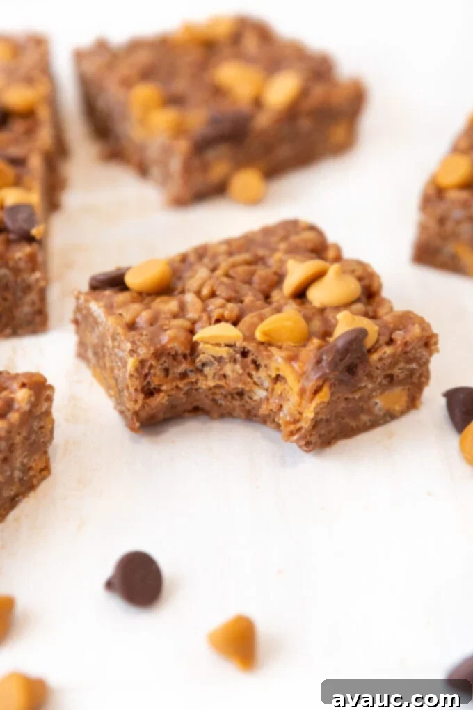 Overhead close-up of several Scotcheroo bars arranged neatly, highlighting their golden color and the bits of butterscotch chips.