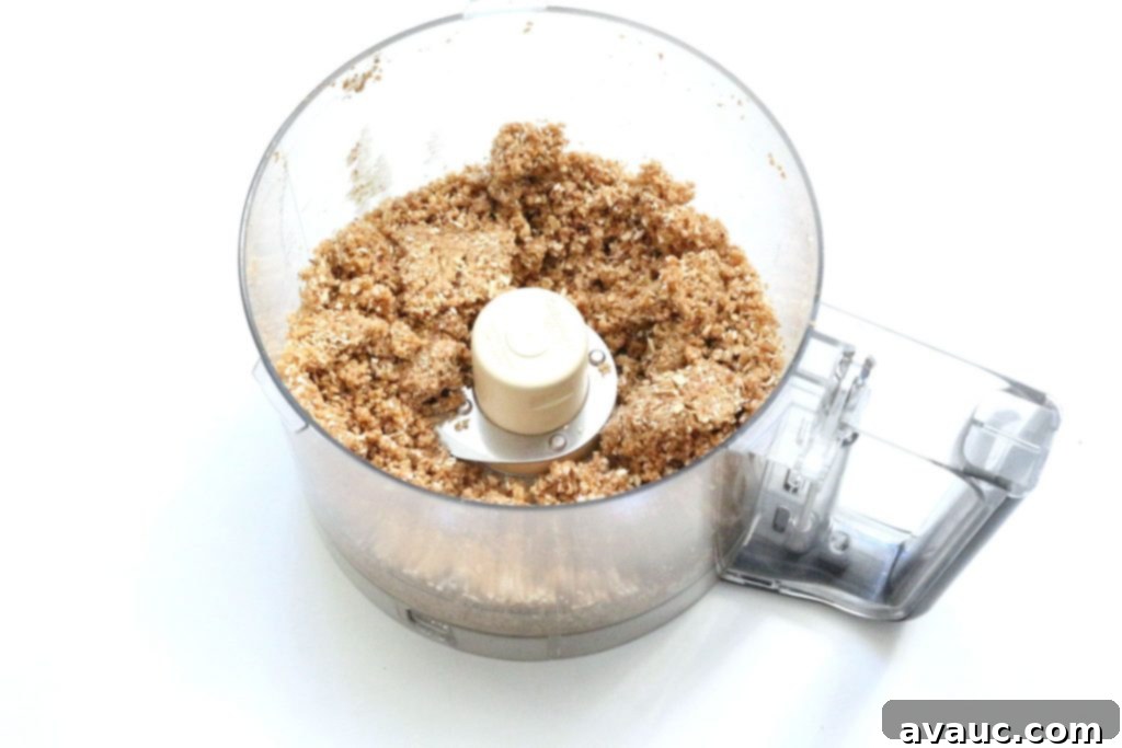 Cohesive dough for coconut cinnamon energy bites, ready for shaping into healthy kid snacks.