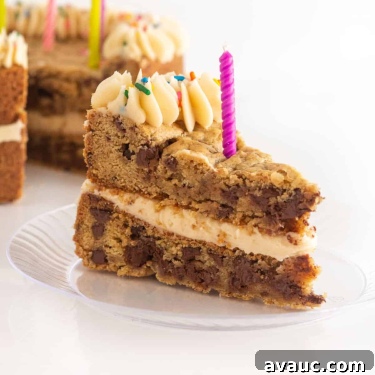 Ultimate Chewy M&M Cookie Cake 10 Double-layered M&M cookie cake with generous frosting between layers and on top, decorated for a party