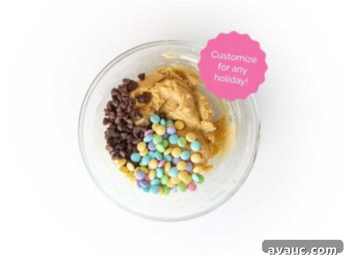 Ultimate Chewy M&M Cookie Cake 13 Bowl of raw M&M cookie cake dough with colorful M&M's mixed in, ready for baking
