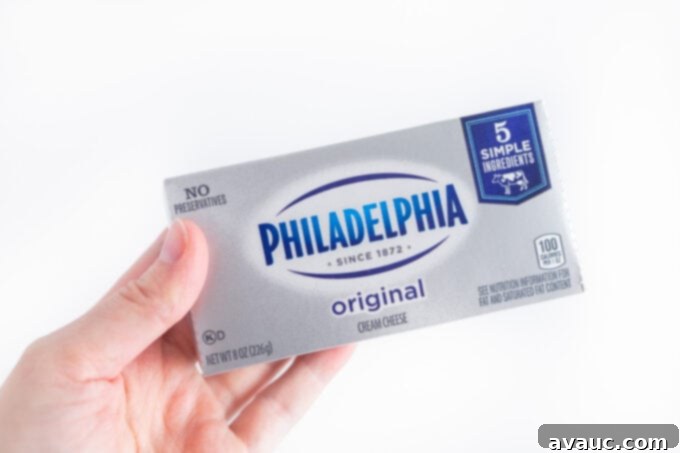 hand holding box of philadelphia cream cheese