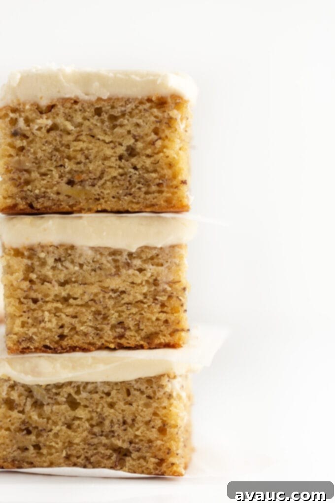Stack of moist banana bars with cream cheese frosting