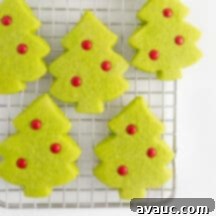 Effortless Christmas Tree Cookies 10 Easy Christmas Tree Cookies, bright green with red M&M ornaments, a perfect simple holiday treat.