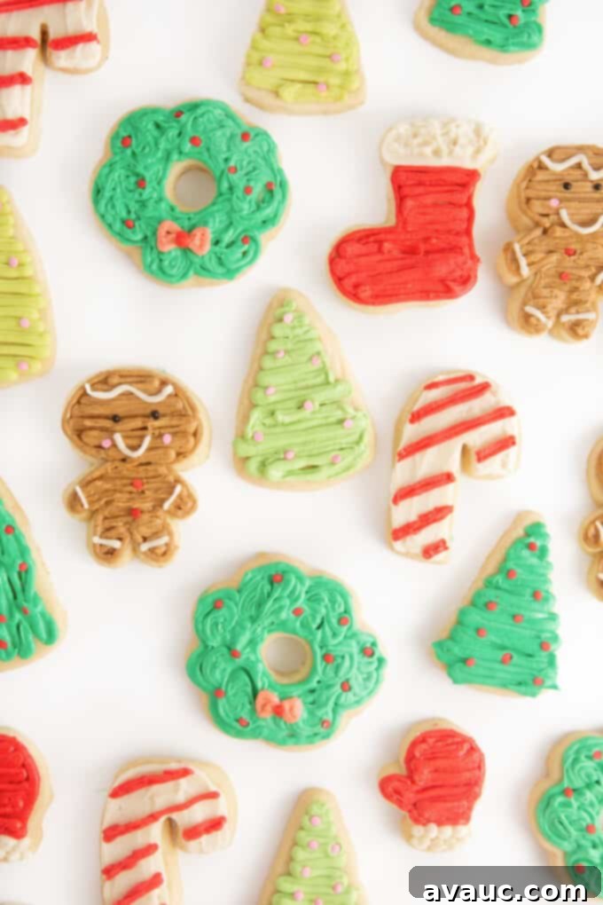 Assortment of decorated Christmas sugar cookies; a wreath, stocking, gingerbread man, christmas tree