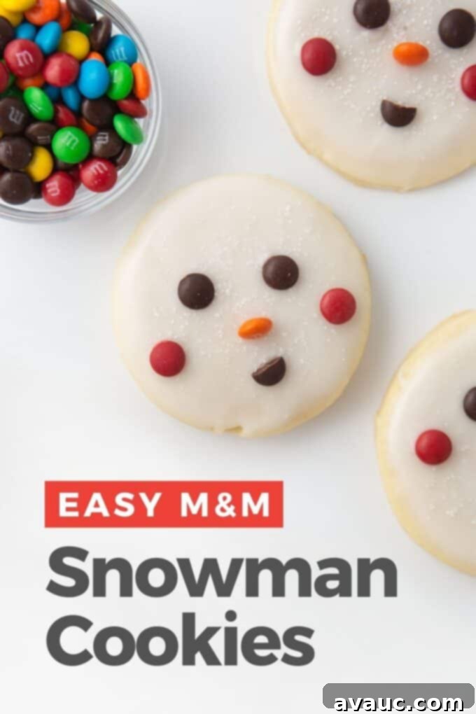 Quick and Easy Snowman Cookies 2 close-up of a beautifully decorated snowman cookie with M&M eyes, carrot nose, and a smiling mouth