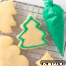7 Fun & Easy Ways to Decorate Sugar Cookies 10 A selection of beautifully decorated sugar cookies using various techniques, showcasing vibrant colors and intricate designs.