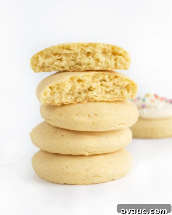 Stack of freshly baked, soft fluffy sugar cookies cooling on a wire rack
