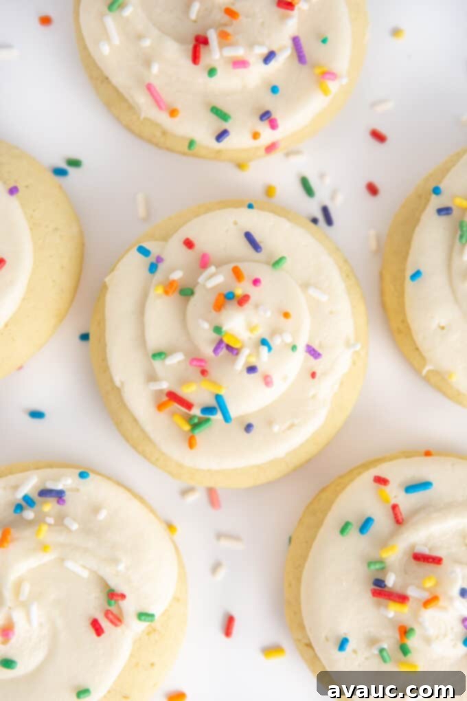 Decorated fluffy sugar cookies with vibrant buttercream and colorful sprinkles